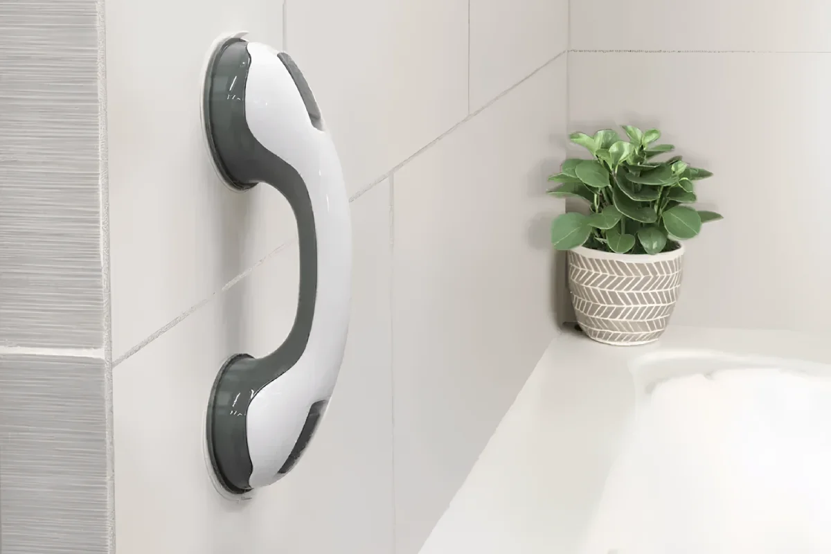 Portable safety handle installed on shower tile